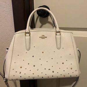 Essential hard leather coach star accented purse